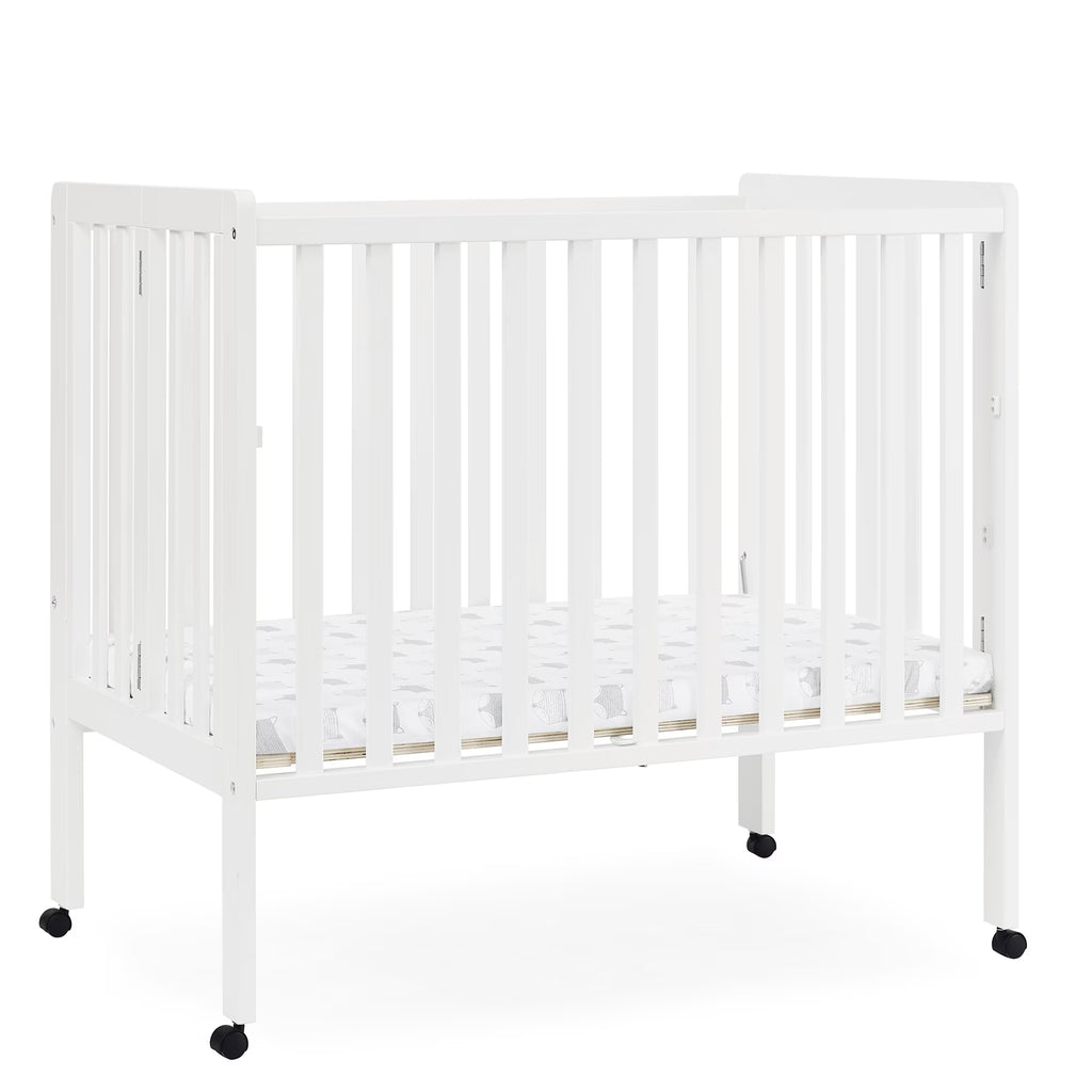 2026 NewDelta Children Lee Portable Folding Mini Crib with 1.5-Inch Mattress - Greenguard Gold Certified, Bianca White