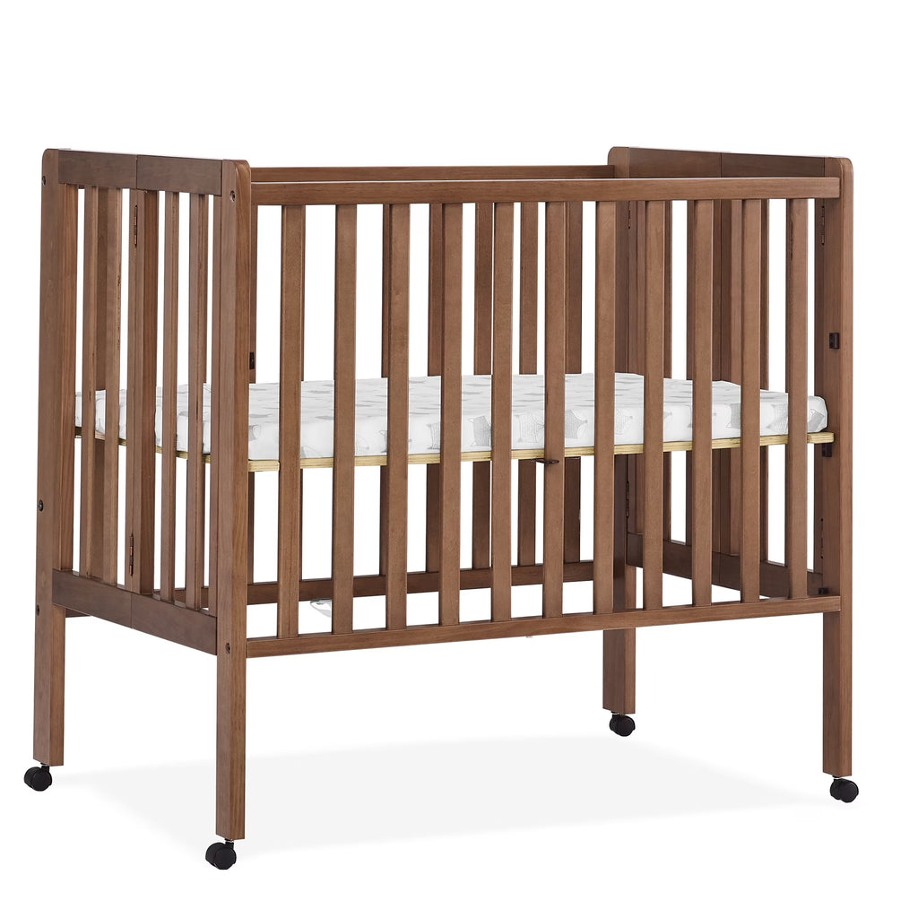 2026 NewDelta Children Lee Portable Folding Mini Crib with 1.5-Inch Mattress - Greenguard Gold Certified, Bianca White
