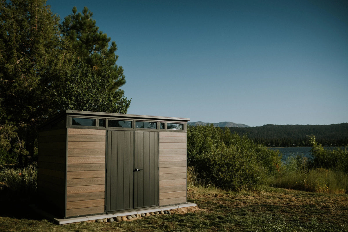 2026 NewKeter Signature 11x7 ft. Durable Resin Outdoor Storage Shed With Heavy Duty Floor and Locking Door, Walnut