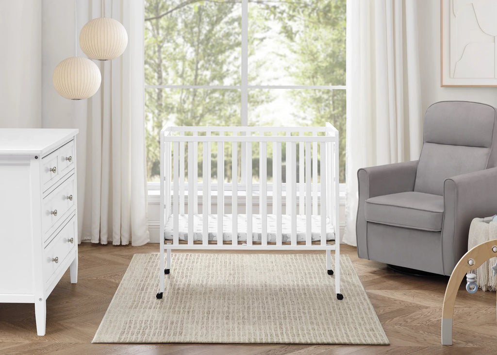 2026 NewDelta Children Lee Portable Folding Mini Crib with 1.5-Inch Mattress - Greenguard Gold Certified, Bianca White