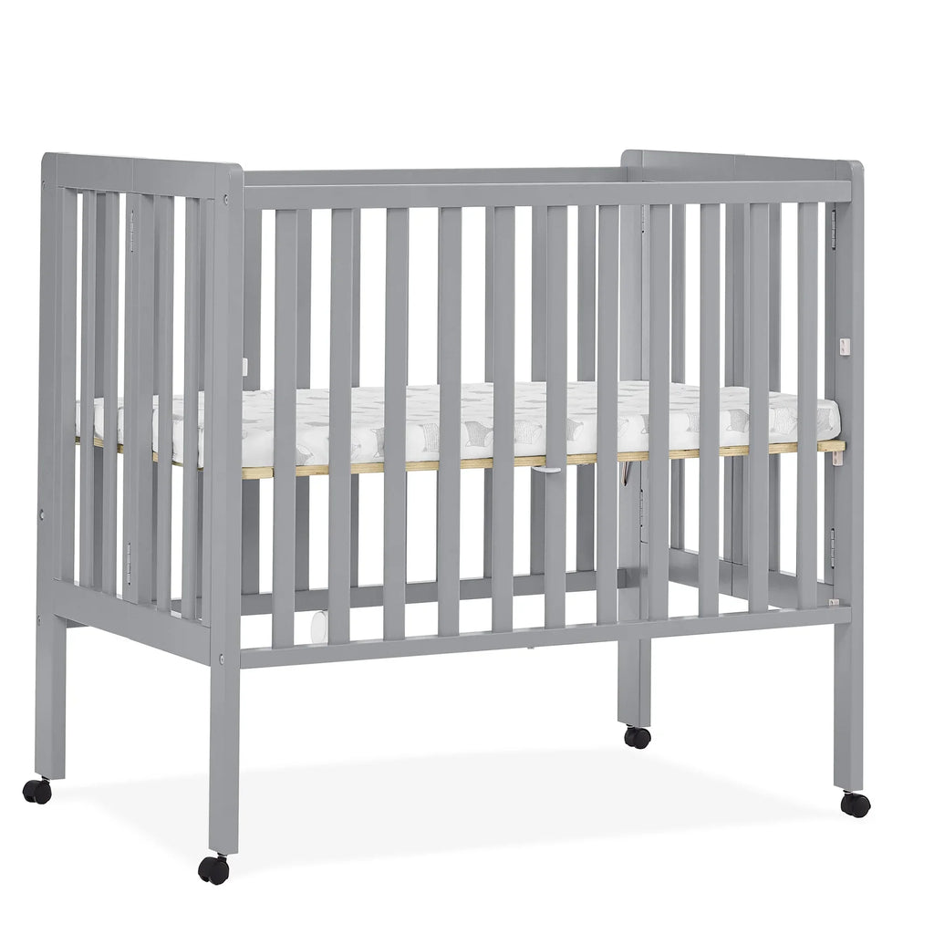 2026 NewDelta Children Lee Portable Folding Mini Crib with 1.5-Inch Mattress - Greenguard Gold Certified, Bianca White